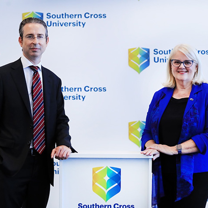 man on left and female on right with podium in middle