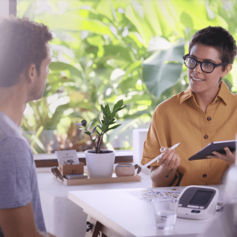 A woman explaining information to a man