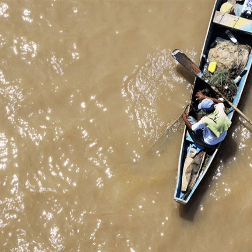 Fisherman in river