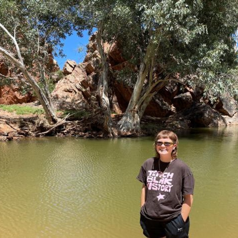 Woman standing by a billabong