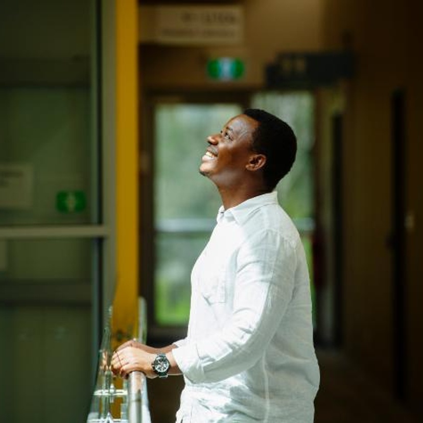 Dieudonne Ininahazwe psychology graduate on campus at Coffs Harbour