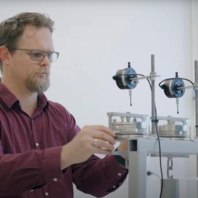 A man adjusting instruments in a laboratory