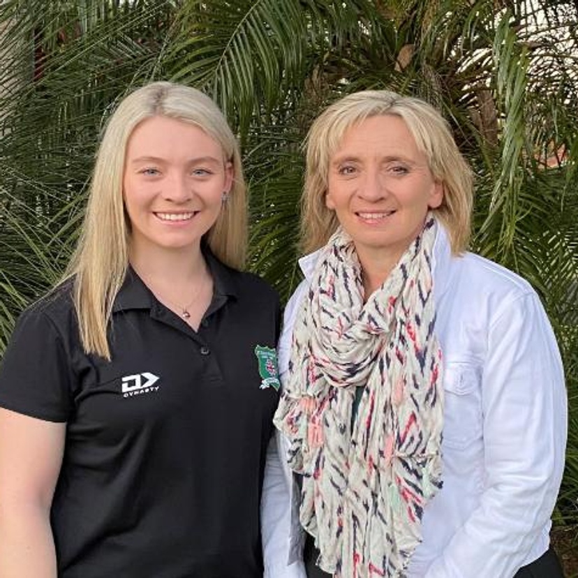 Daughter and mother, Maddie (left) and Rose (right) Smith, standing in front of a garden.