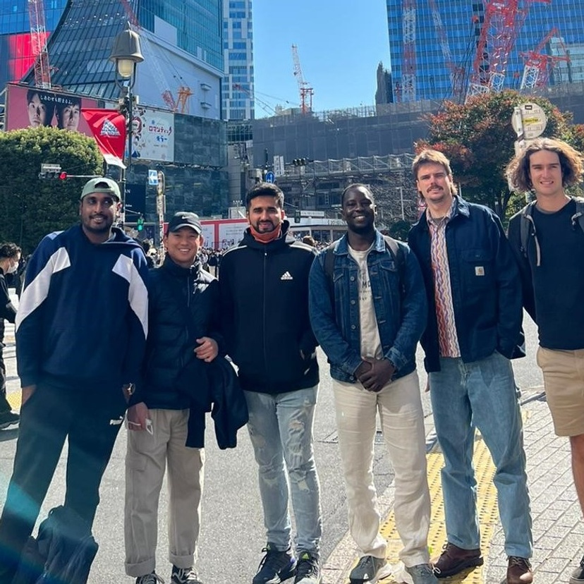 Group of students pose in front of Tokyo skyscrapers
