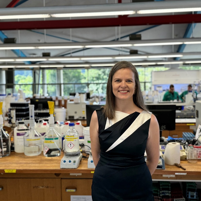 A woman standing in a chemistry lab