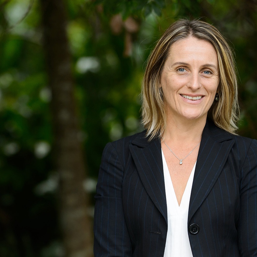 Sue Higginson sitting under a tree