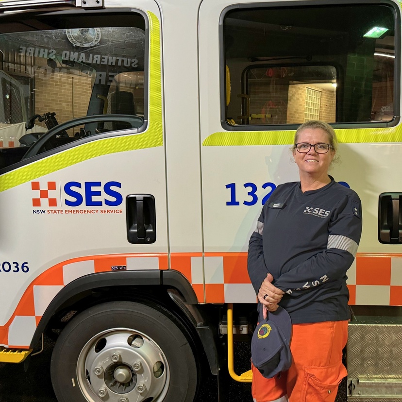 SES Deputy Unit Controller Bridget Clark stands in front on a State Emergency Services vehicle