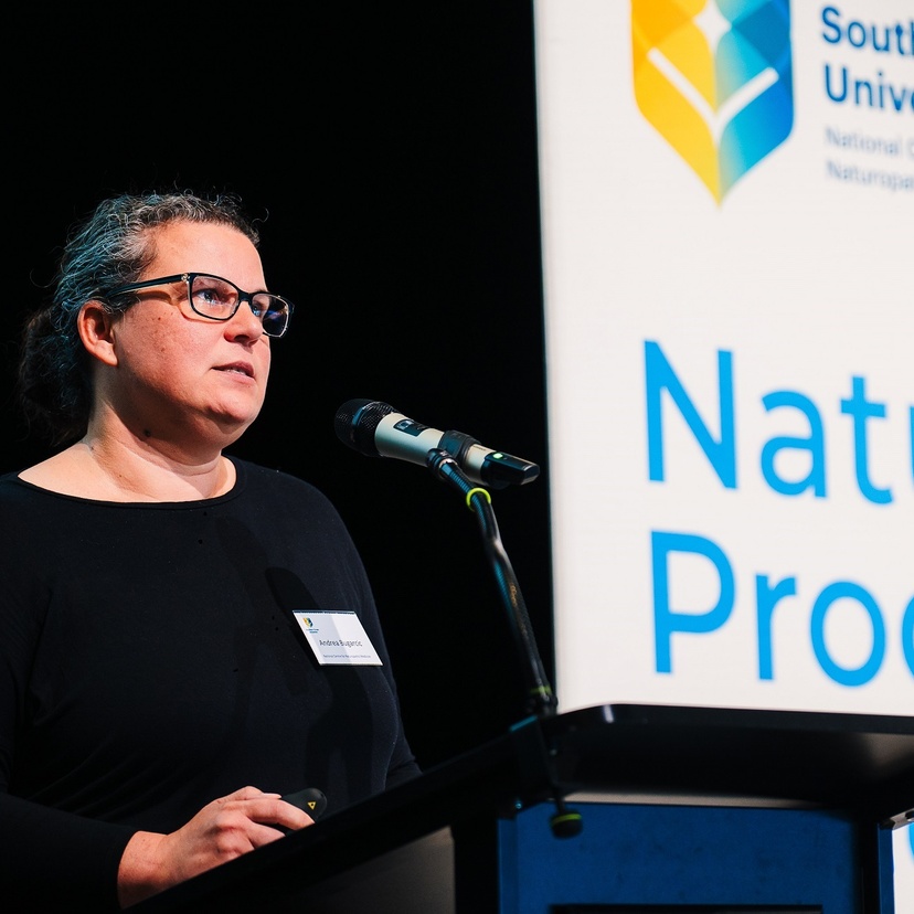 A woman standing at a lectern