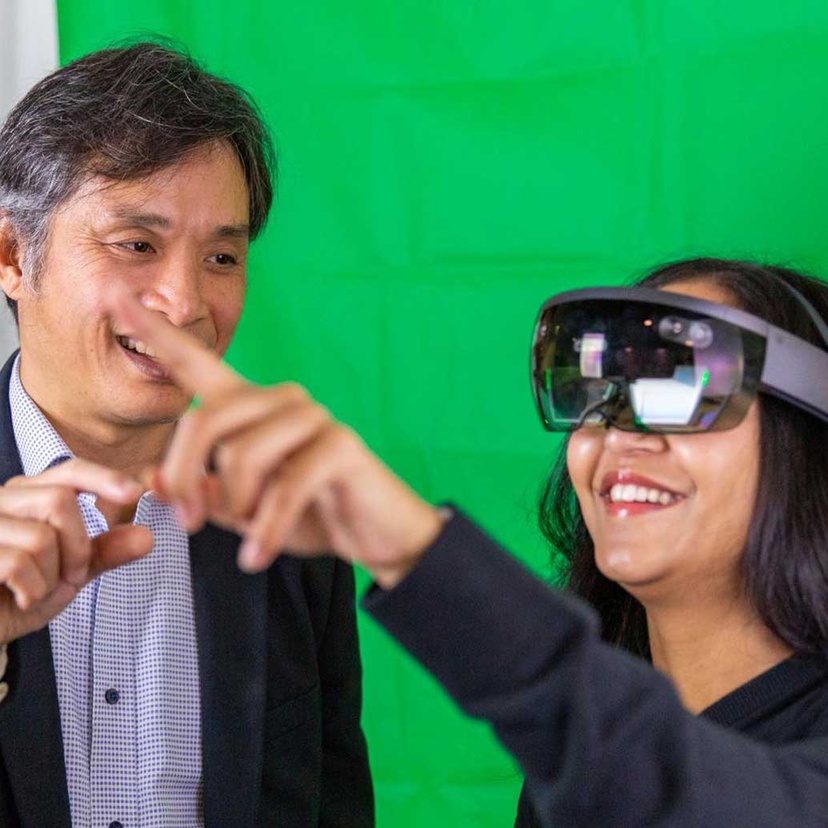 Two people using VR goggles