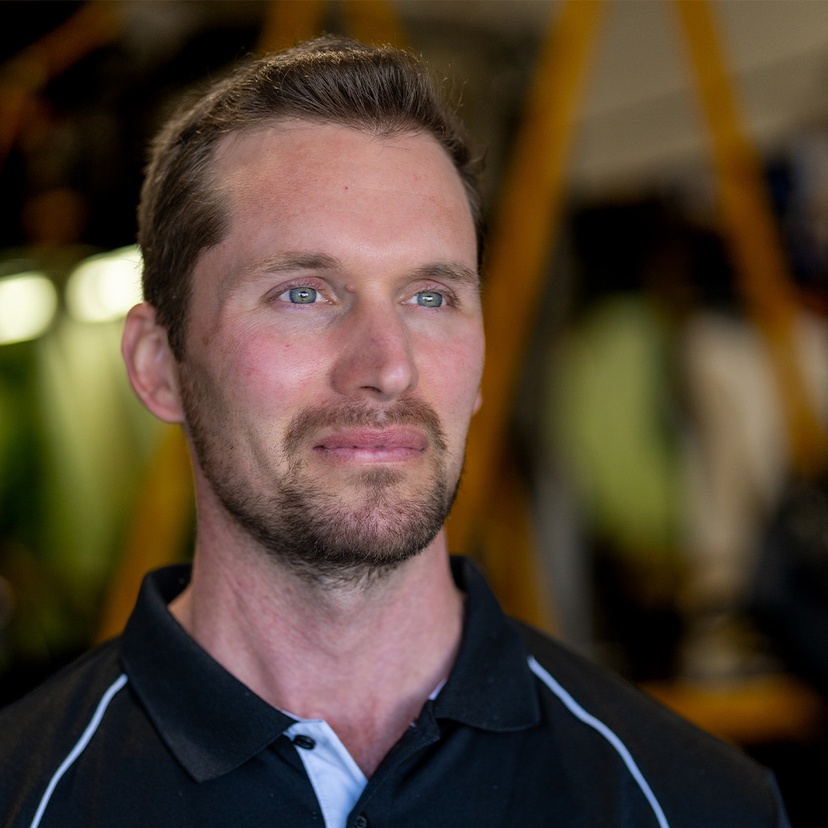 Headshot of man looking off camera