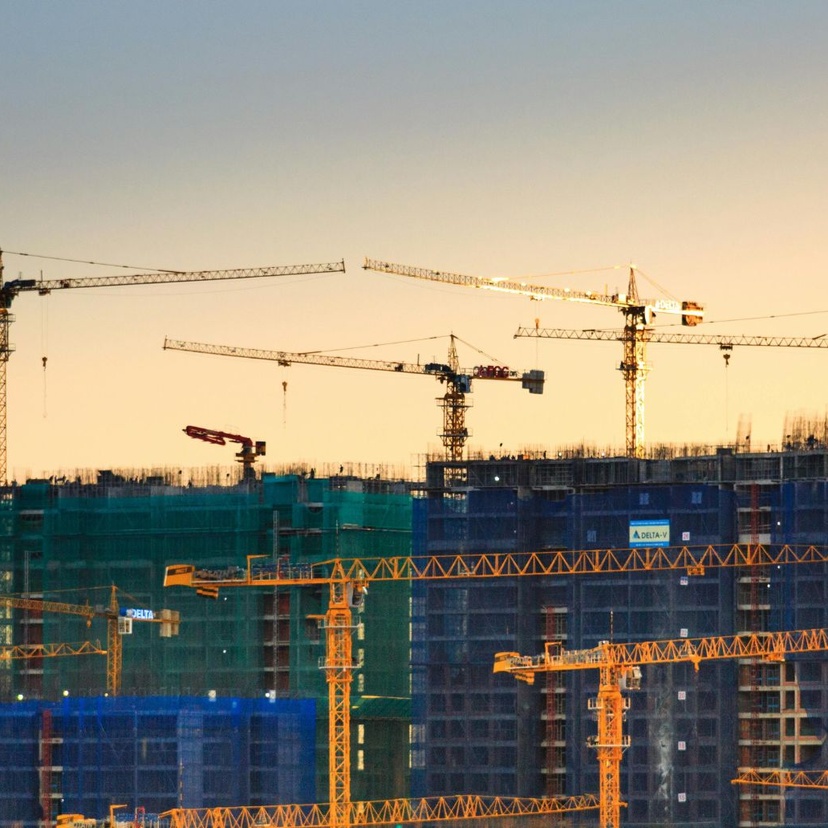Skyline of cranes above building site