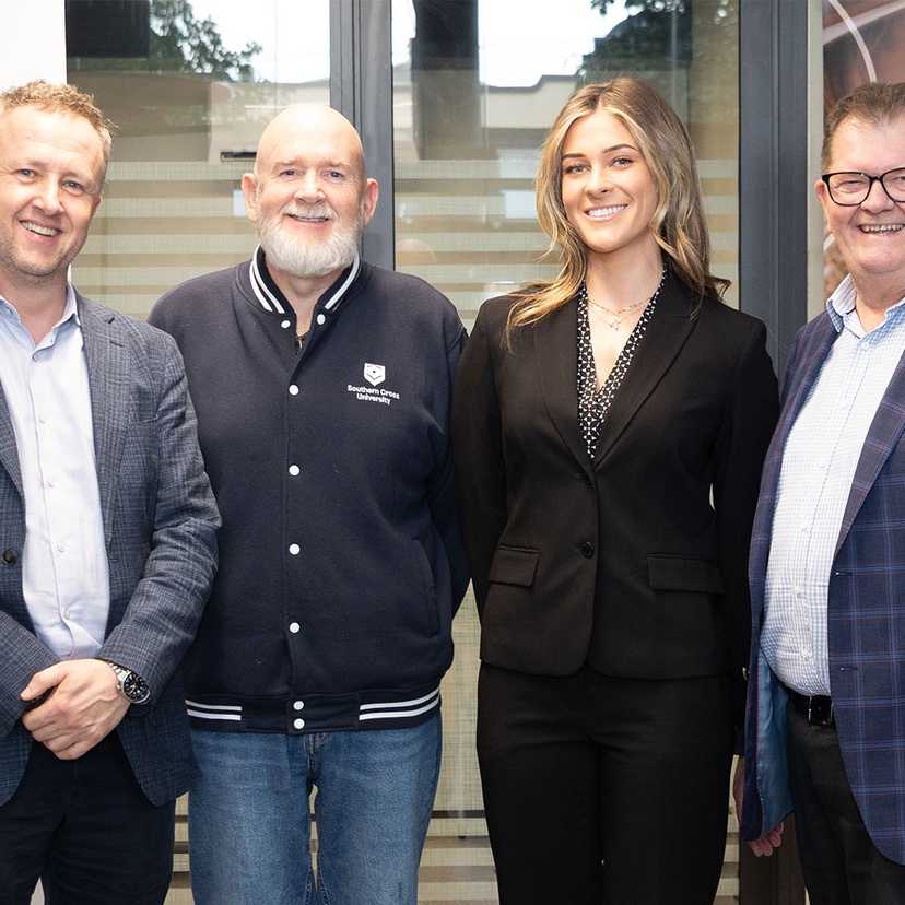 Ben Roche, Mike Ewing, Isabella Dowd and John Williams smiling at camera