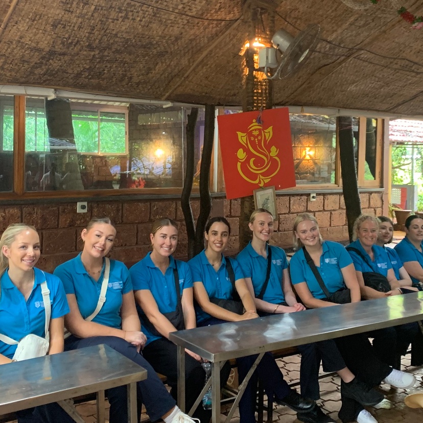 A group of students sitting in a row