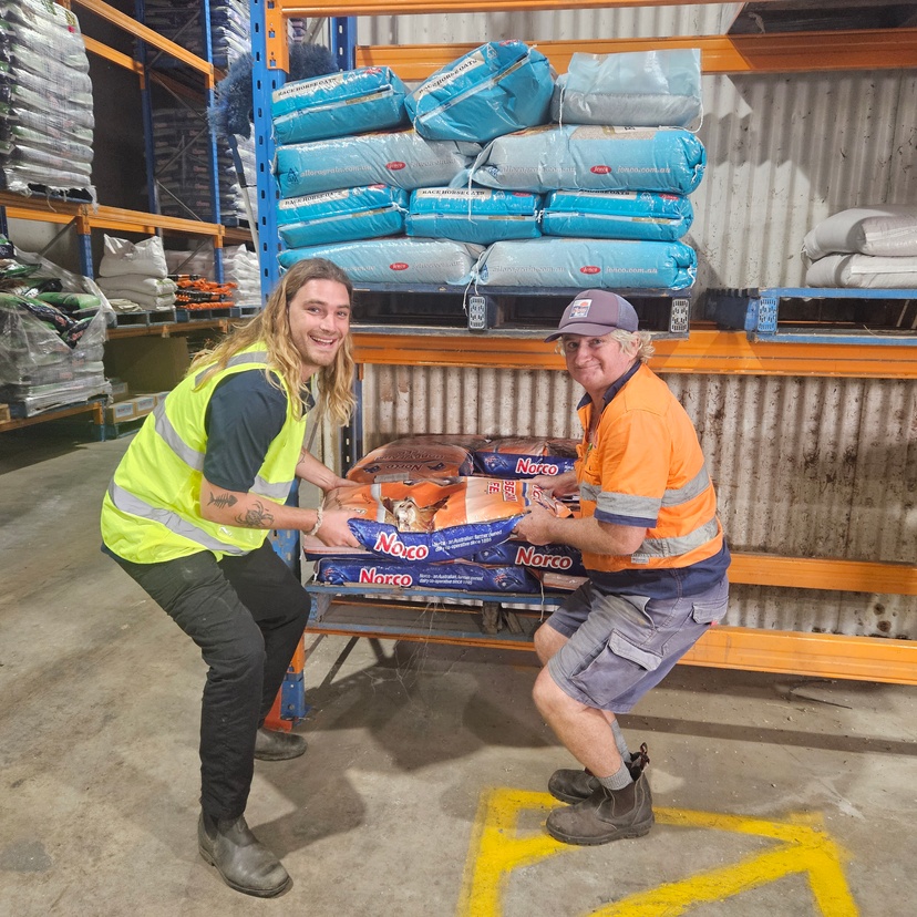 OT student Lachlan Andrews and Norco worker Gary Vidler do two person lift