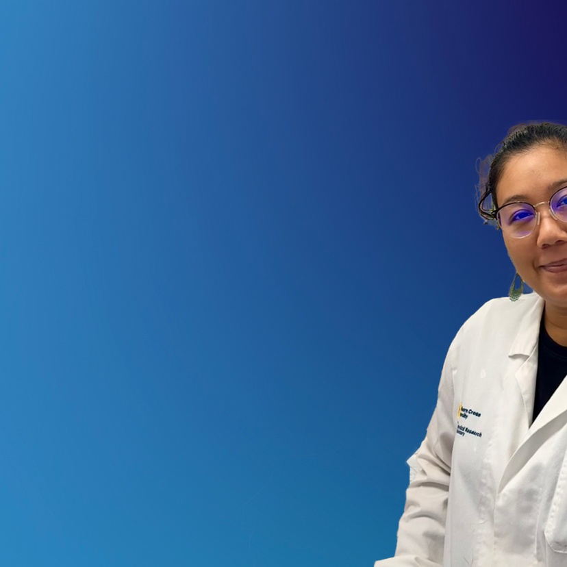 A scientist in a lab coat on a blue background