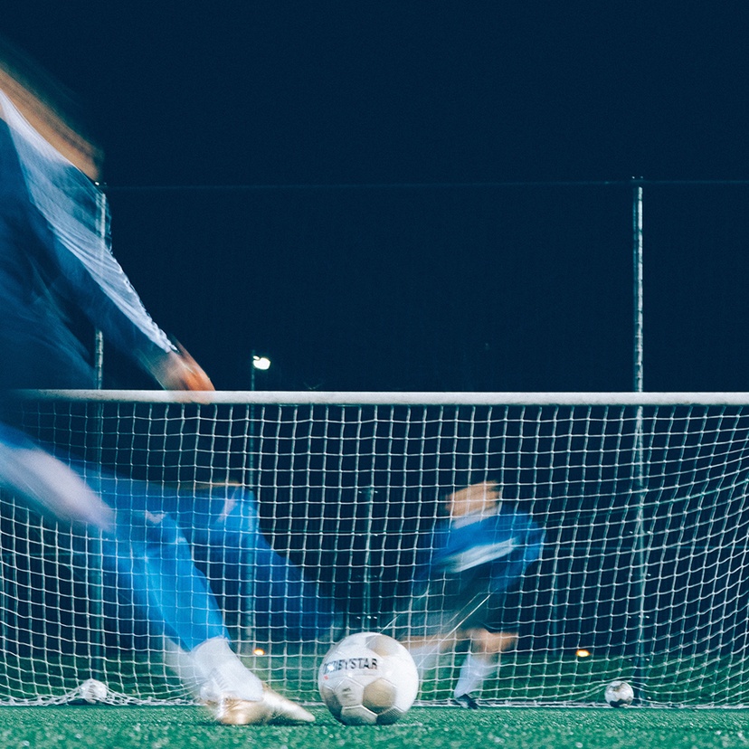 Soccer ball, players and net