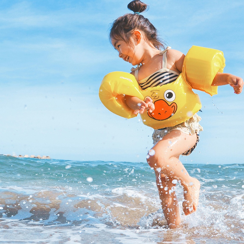 Happy child playing at beach