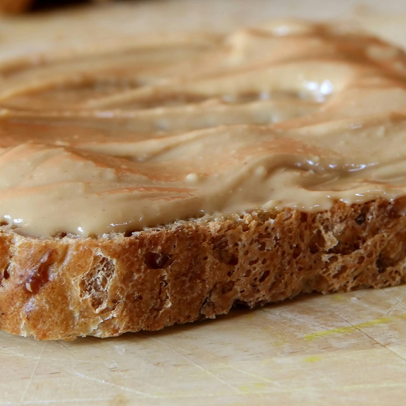 Sliced bread with peanut butter topping