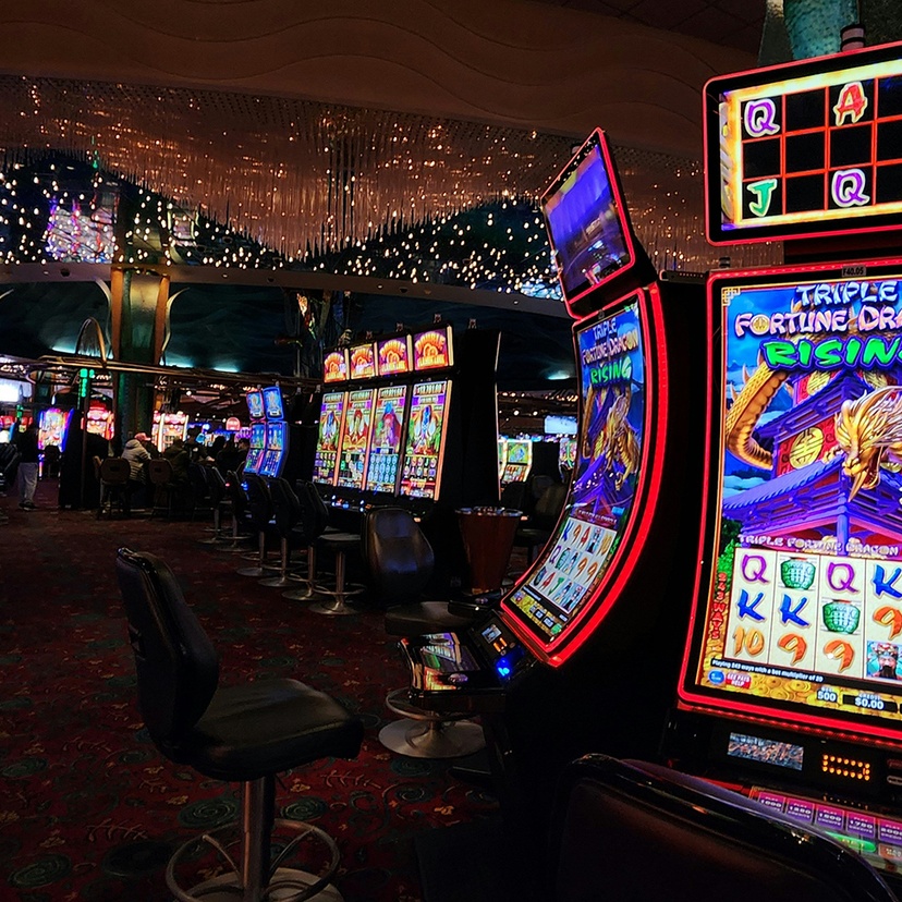 Casino room filled with lots of pokies
