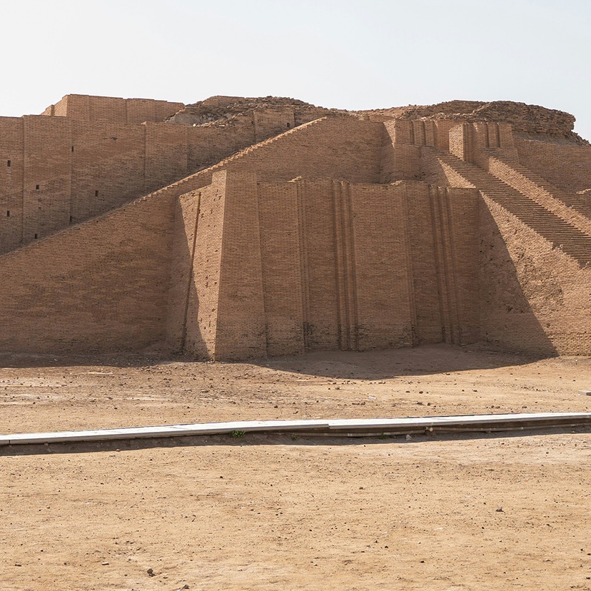 Large stone structure sitting in the middle of a desert