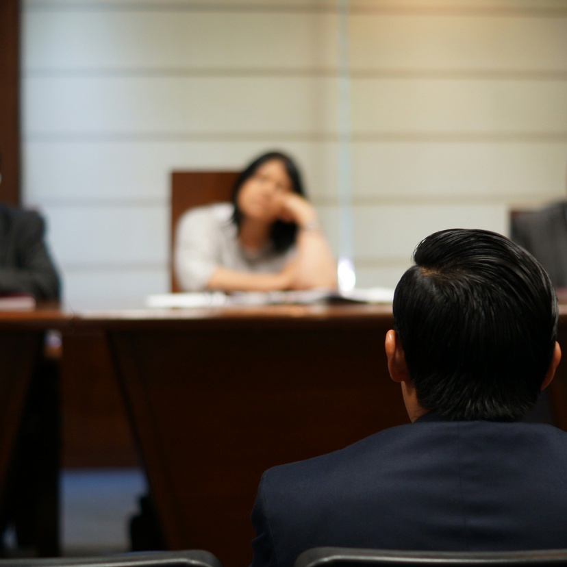 People sitting in a small court room