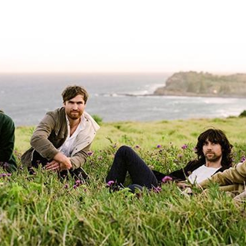 men sitting on headland