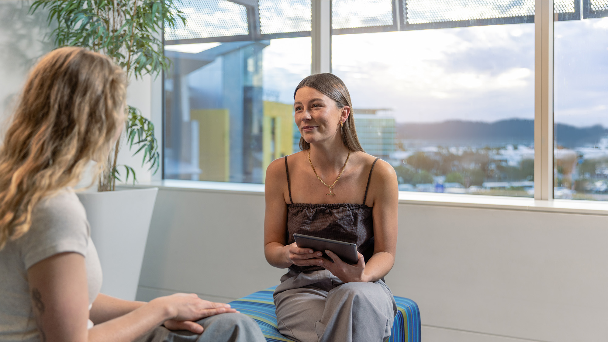 Two people sitting and talking