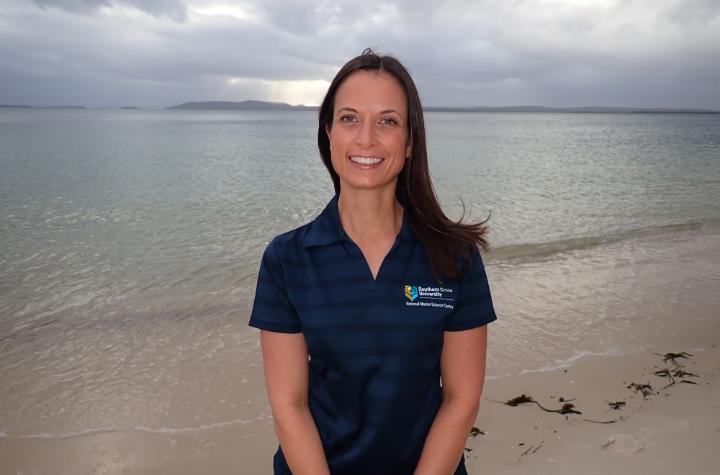 Events and News Woman in front of an ocean wearing a SCU-logo polo
