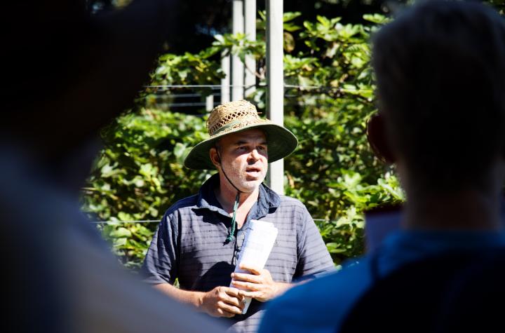 A man talking to a group of students