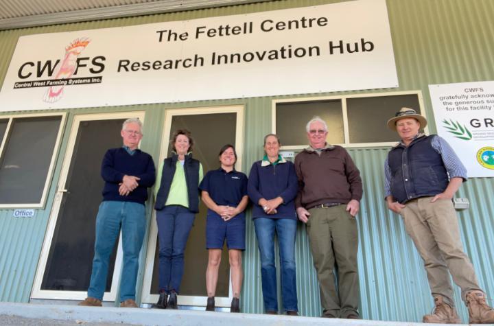 A group of six people standing outside the office of Central West Farming Services