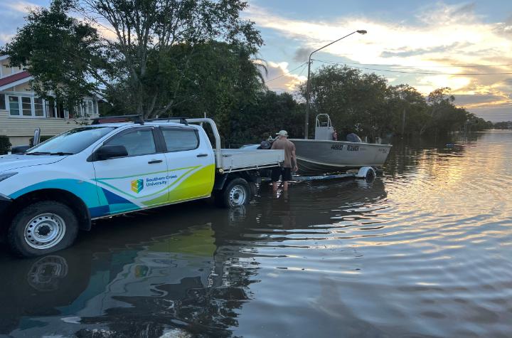 Events and News Professor Bradley Eyre loading the University research boat from Lismore flood waters