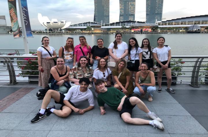 Students in Singapore in front of bay