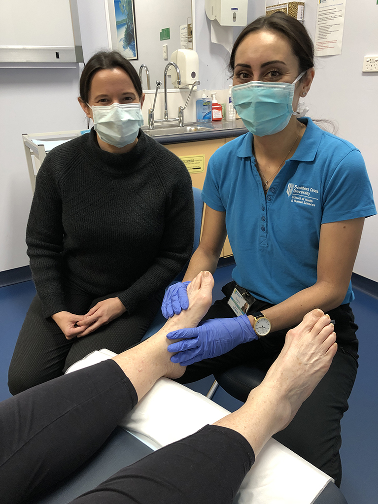 Alex Barwick and Kasandra Child at podiatry clinic for flood affected