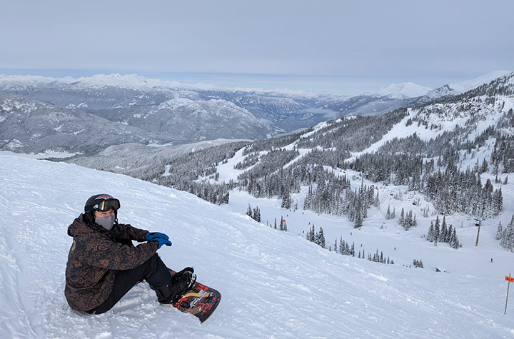 A person snowboarding in the snow