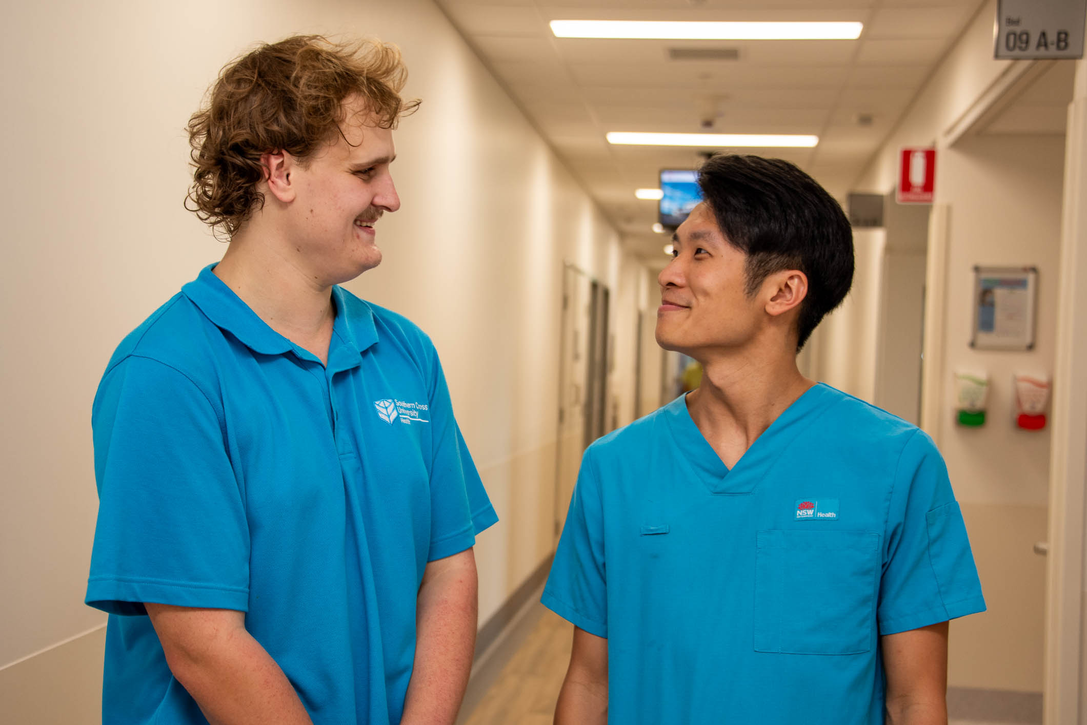 Two male health workers in a hospital setting