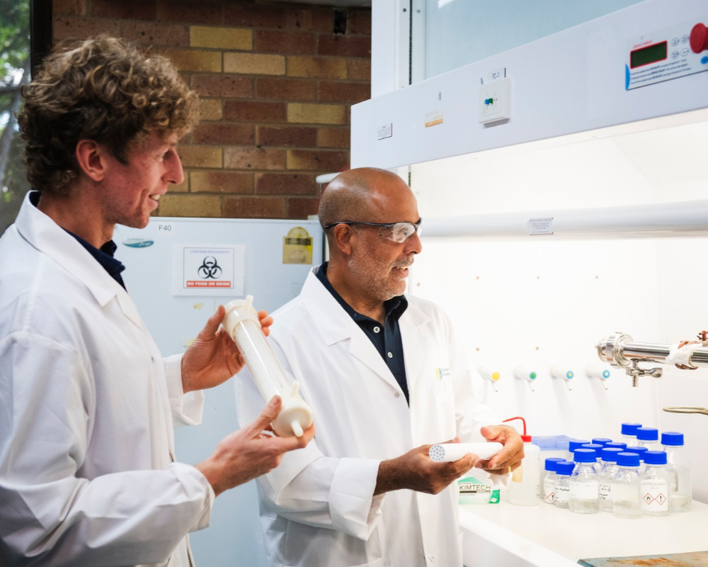 PhD researcher Michael Ingram with Professor Dirk Erler in the lab