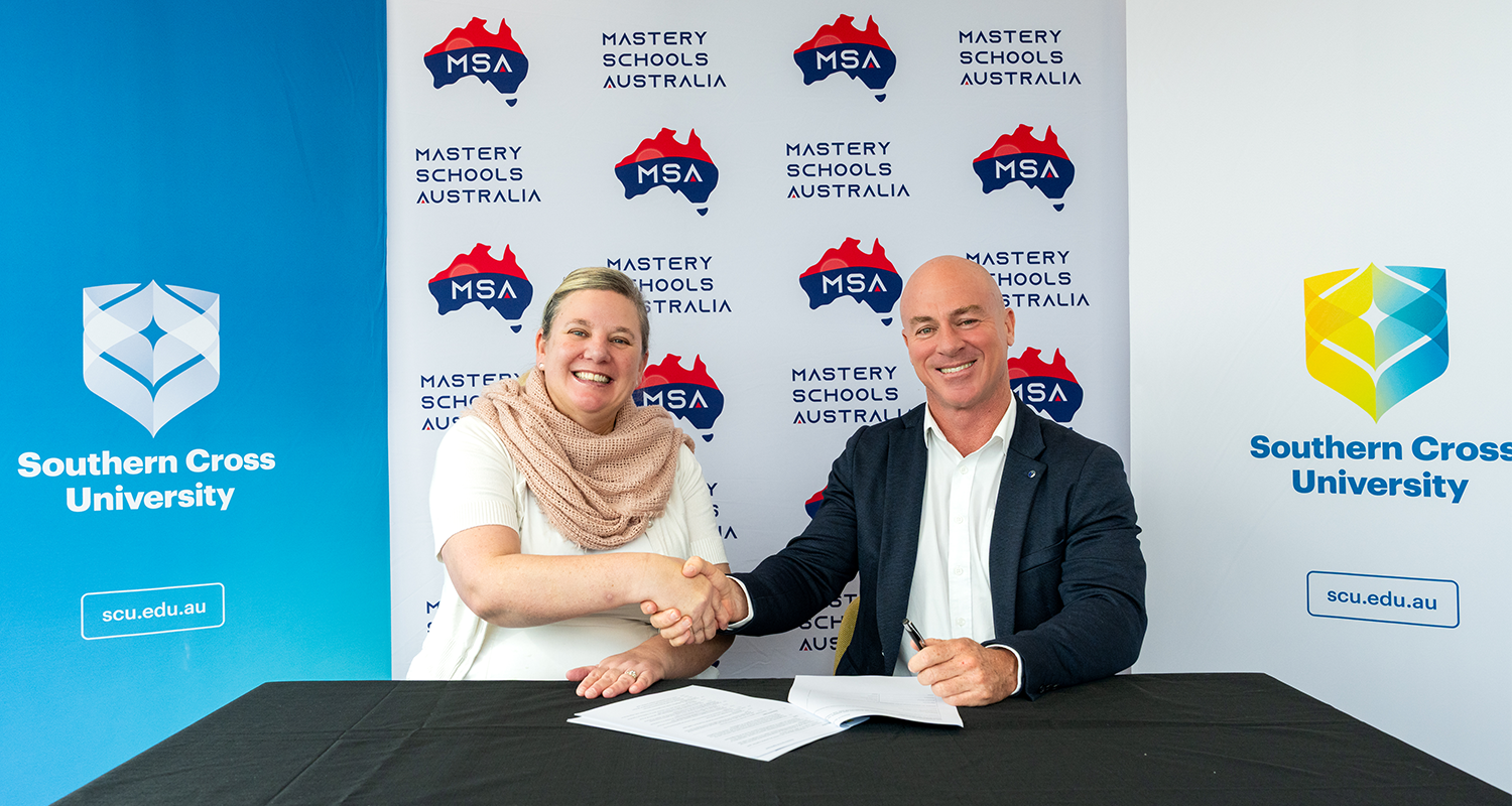 Professor Amy Cutter-Mackenzie-Knowles and Director Michael Roberts, MSA Manag shaking hands