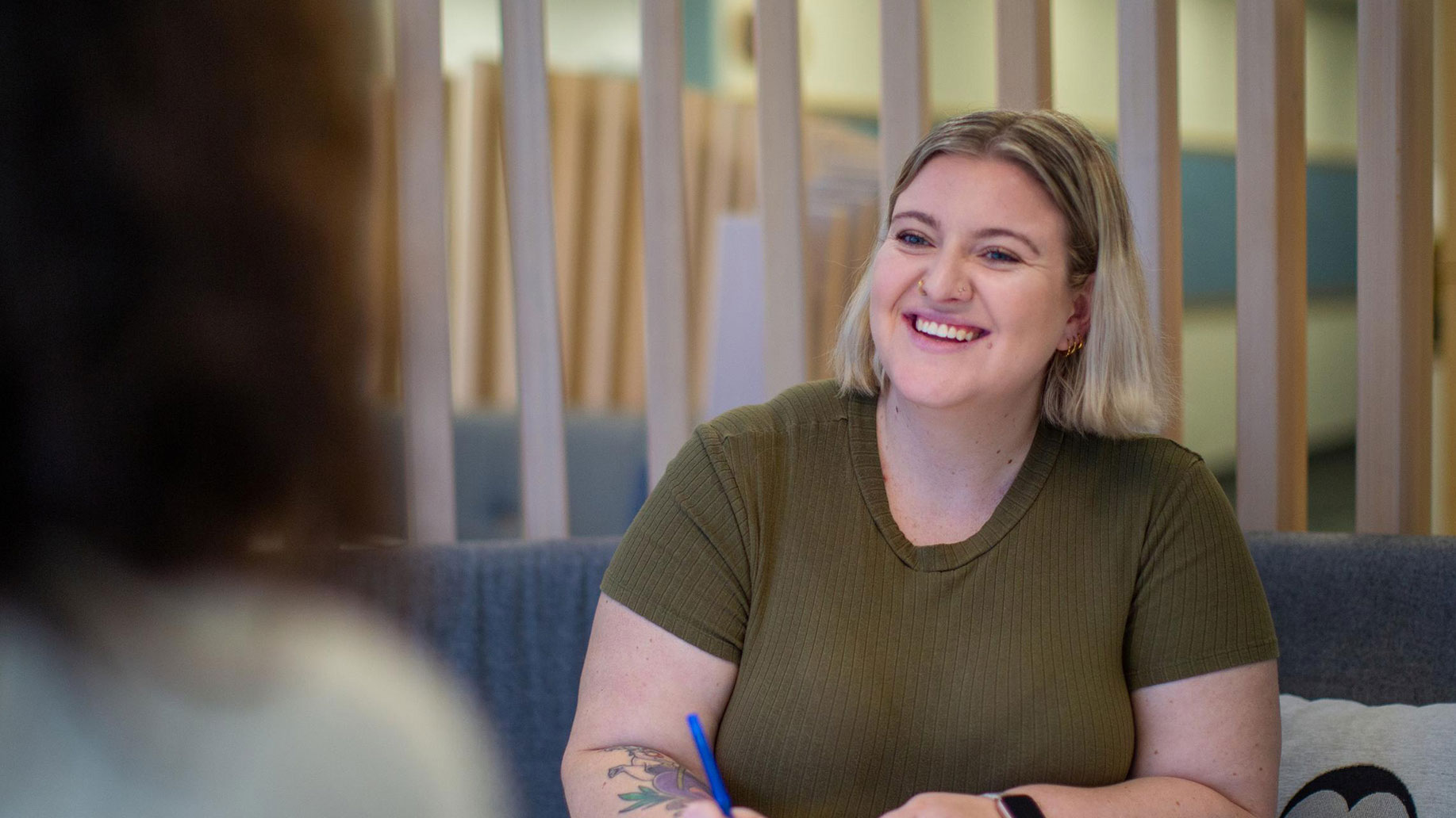 Student sitting across from someone and smiling